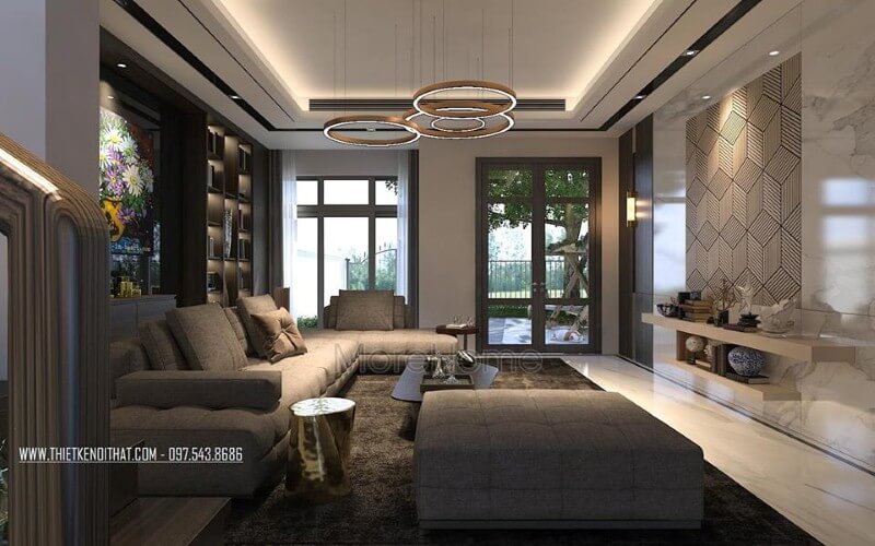 Phòng khách hiện đại sắc trầm nhưng rộng rãi, thông thoáng với cửa sổ, cửa chính kính lớn. Tổng hợp các mẫu kế phòng khách sang trọng