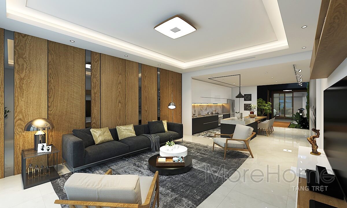Nội thất sofa bọc vải dài hiện đại với tông màu tối giúp không gian phòng khách hài hòa về màu sắc trong phòng Morehome chia sẻ các mẫu thiết kế sofa phòng khách cao cấp tiện nghi nhất