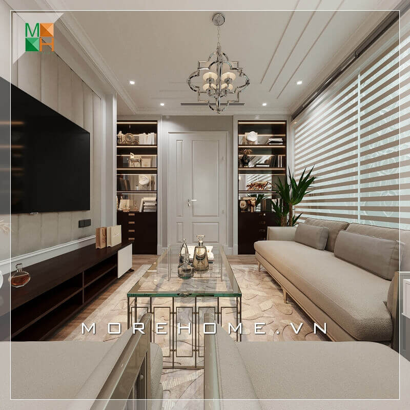 Một phòng khách tân cổ điển đẹp sẽ phải thể hiện được rõ nhất tính năng của nó bằng cách lựa chọn nội thất thông minh và lựa chọn màu sắc phù hợp nhất đối với thiết kế ngôi nhà. Lựa chọn một bộ sofa sang trọng màu kem sữa kết hợp với chiếc bàn bằng kính rất đẳng cấp, Kệ TV nhìn khá đơn giản nhưng rất hài hòa với những nội thất khác trong căn phòng. Sự kết hợp nội thất trong căn phòng khách ăn ý và logic đã tạo nên một không gian phòng khách tiện nghi và sang trọng. Gợi ý các mẫu bố trí phòng khách tân cổ điển hot nhất