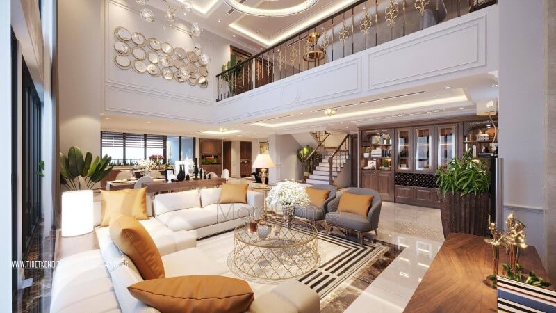 Bộ bàn ghế sofa da cao cấp thiết kế đơn giản với tông trắng kem được lựa chọn với điểm nhấn gối tựa cam đất kết hợp với bàn descor chân inox mạ vàng đẹp ấn tượng BST các mẫu thiết kế sofa phòng khách ưa chuộng nhất